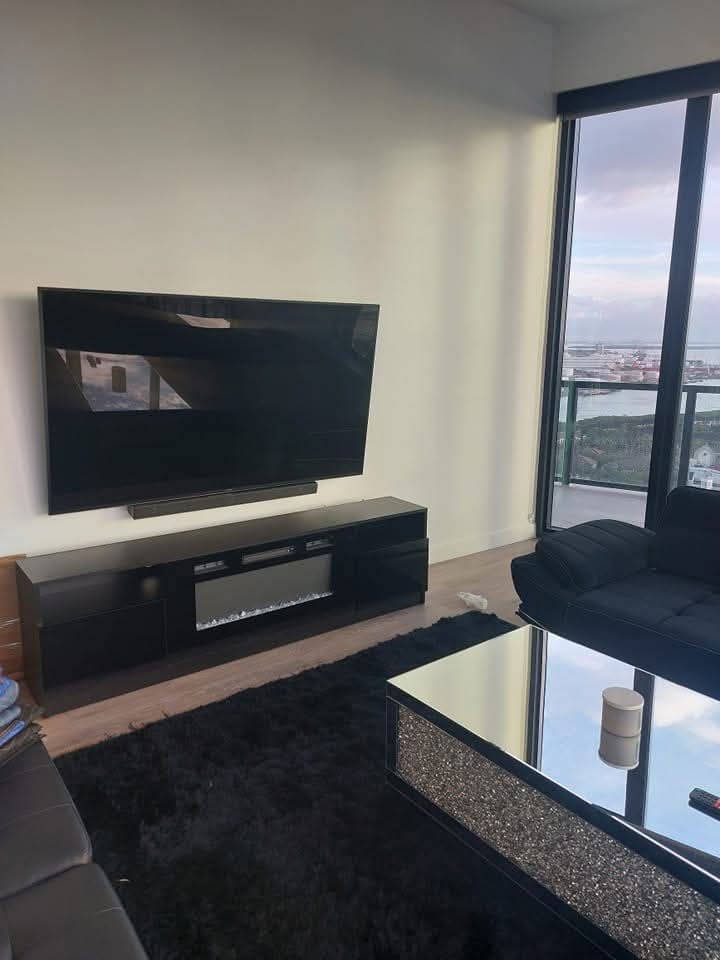 75" TV Mounted with soundbar in Channelside, FL