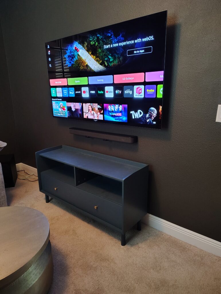 65" TV mounted with soundbar in South Tampa, FL
